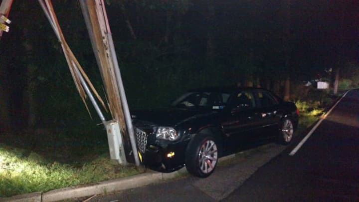 A drunk driver crashed into a telephone pole, splitting it in half.