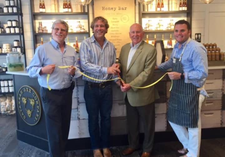 First Selectman Jim Marpe and Chamber of Commerce Executive Director Matthew Mandell join founder and owner Ted Dennard and Bob Kemp, head of retail, at the ribbon cutting for the Savannah Bee Company.