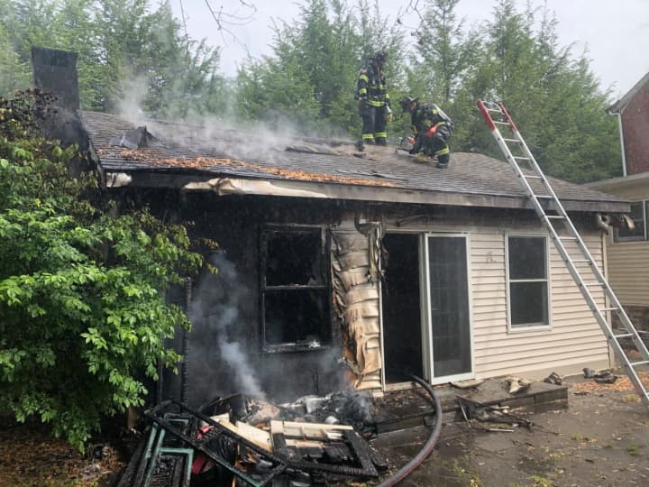 Fire crews in Hunterdon County arrived “in about a minute” at the scene of a brush fire that fully engulfed an adjacent home Friday morning.