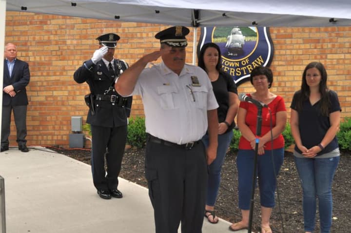 Haverstraw Police Chief Charles Miller gives a final salute before his retirement on June 23.