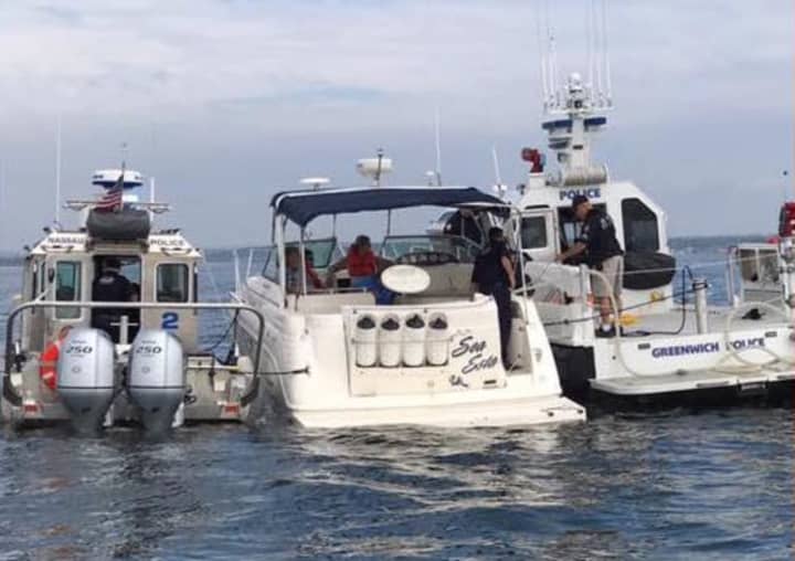 The Greenwich Police Marine Section comes to the aid of a boat taking on water in Long Island Sound on Saturday morning.