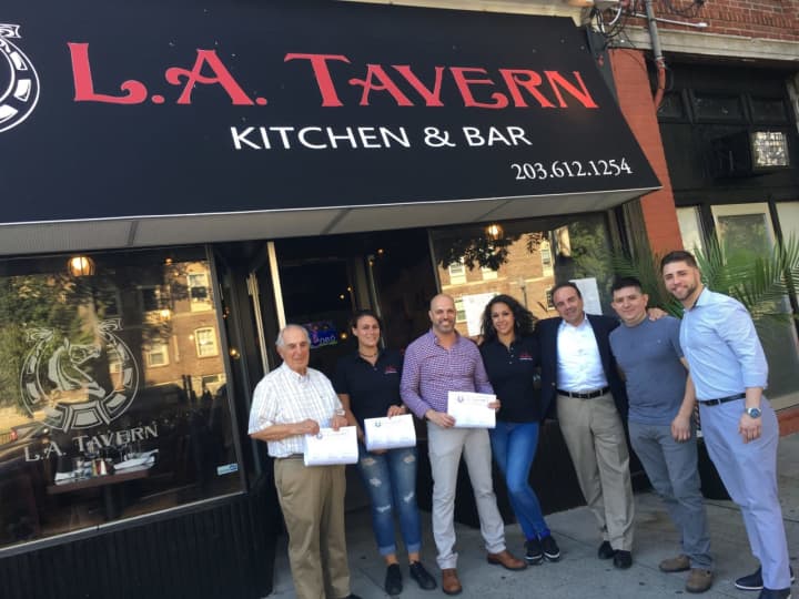 Mayor Joe Ganim, third from right, was on hand as L.A. Tavern held its grand opening in Bridgeport this week.