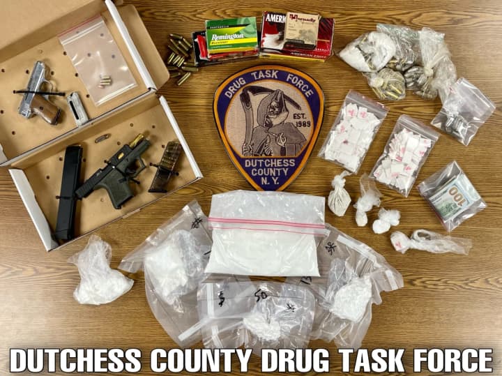 The drugs and guns that were seized during the warrant search.