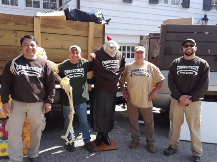 From left to right the Connecticut Junk Removal Crew: Harry, Juan, Glen Jennings and Raul Carbuccia (sales manager) with a crazy ghoul they found in the attic of the clean-out  and dressed in a company t-shirt.