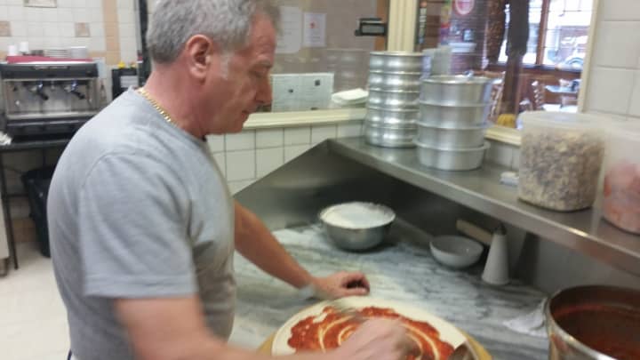 Angelo Oliviero saucing up a pie.