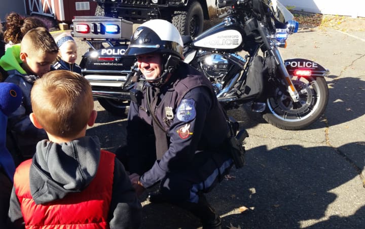 Rutherford Police Officer Steve Villareale talks to kids about motorcycle safety.
