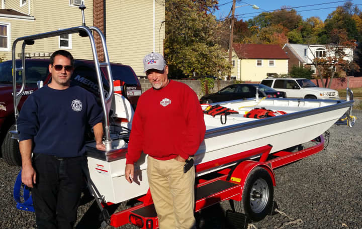 Rutherford Fire Chief Craig Scott and Councilman Jack Manzo with the new boat.