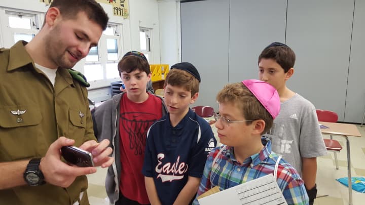 Students at Valley Chabad in Woodcliff Lake meet an Israeli soldier.