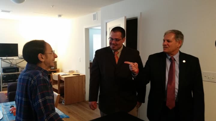 Tom Kania shows off his new home to Tedesco and AJ Bauer, director of veterans affairs.