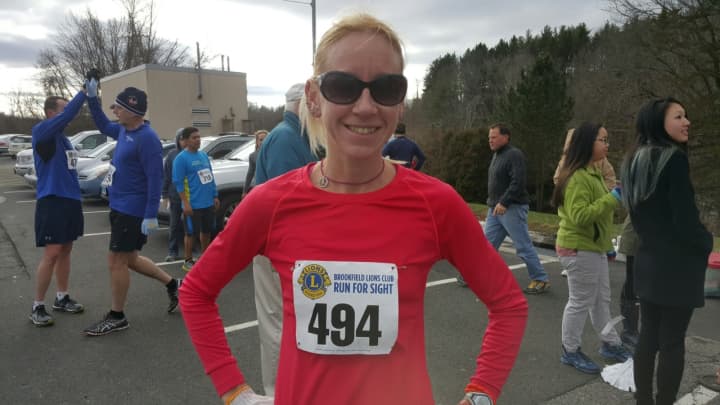 Sara Belles of Brookfield posts the fastest time among female runners in the New Year’s Day Brookfield Lions Run for Sight 4-mile race on Friday.