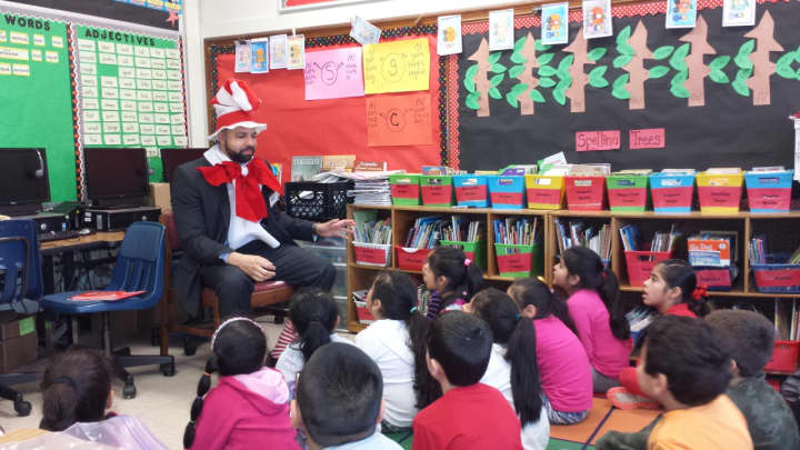 Bryant Romano, assistant principal at JFK Magnet School, read &quot;Green Eggs and Ham&quot; to second graders at Edison Elementary School in Port Chester on Wednesday marking Dr. Seuss&#x27; 112th birthday and &quot;Read Aloud Day.&quot;