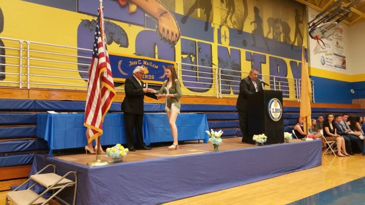 Lindsay Henning receives a scholarship.