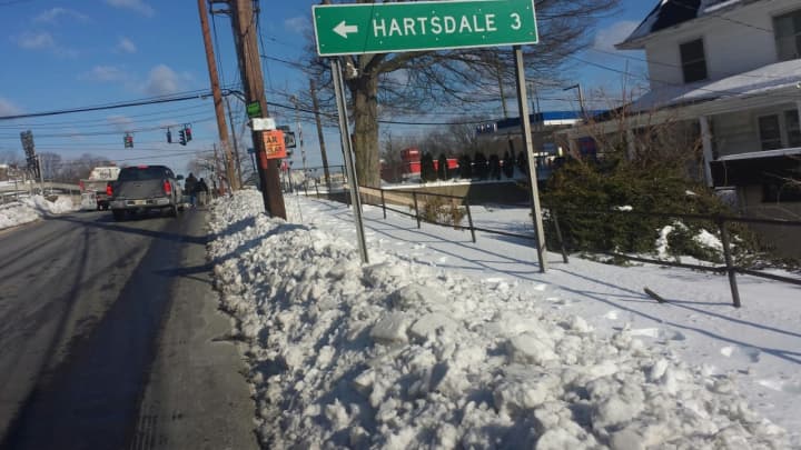 Snow-covered sidewalks overflow onto Route 119 in Greenburgh near Knollwood Road.