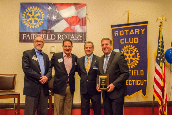 Saying thanks to Jon Miller of NBC Sports Group (far right) are current Fairfield Rotary Club President Gary Kealey, Emcee/ Moderator Mark Graham, and future Fairfield Rotary Club President Sam Topal.