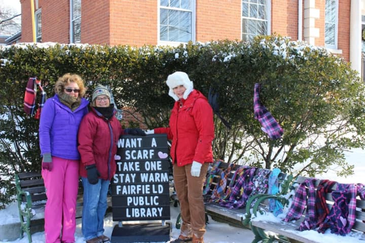 Members of the Purls of Wisdom Knitting Group and the Sewing Salon gave away hundreds of free scarves, hats and mittens in the second annual Yarn Bombing at Fairfield Public Library.
