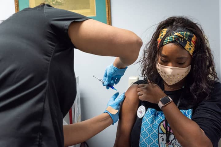 A subject getting the Novavax vaccine during clinical trials.