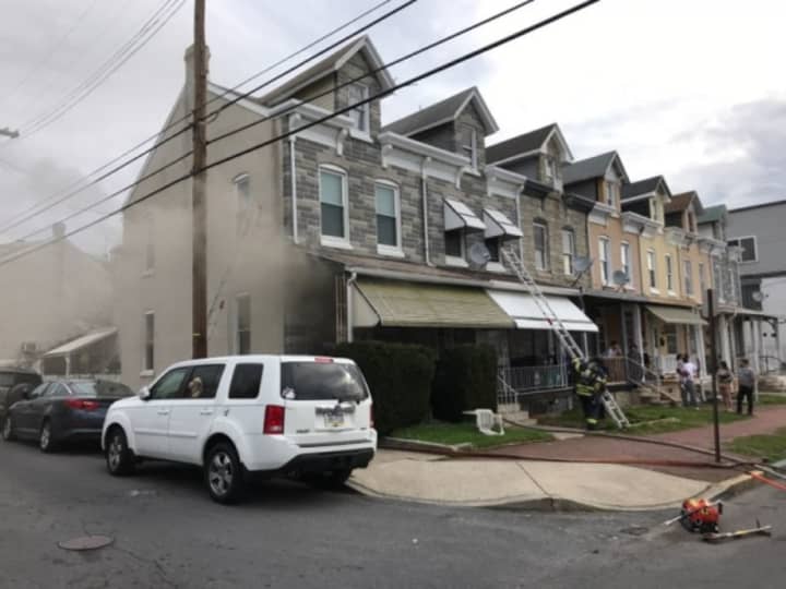 Reading firefighters rescued a woman from a smoke-filled house Friday morning.