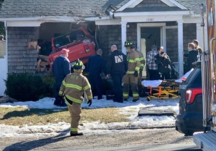 A pickup truck was launched into a home after the driver suffered a medical event.