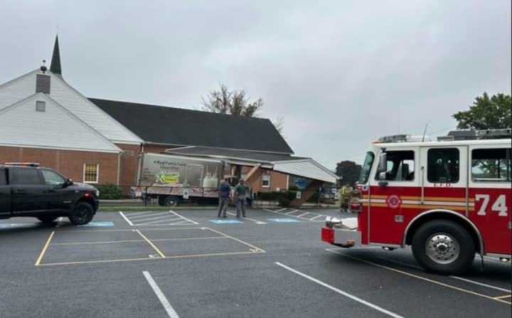 The scene of box truck into the church with emergency crews responded.
