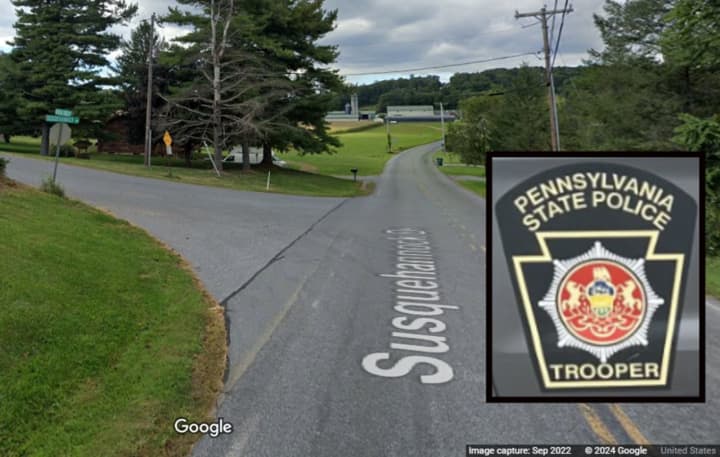 A Pennsylvania State Police vehicle and the intersection where the stabbing happened, according to troopers.&nbsp;