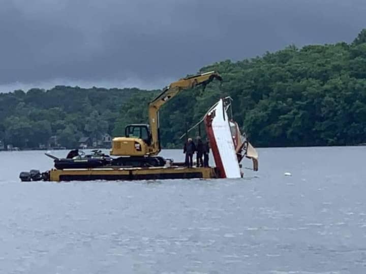 The operator of a personal watercraft was hospitalized after crashing into a 25-foot boat on Lake Hopatcong and causing both vessels to sink Monday night, state police confirmed.