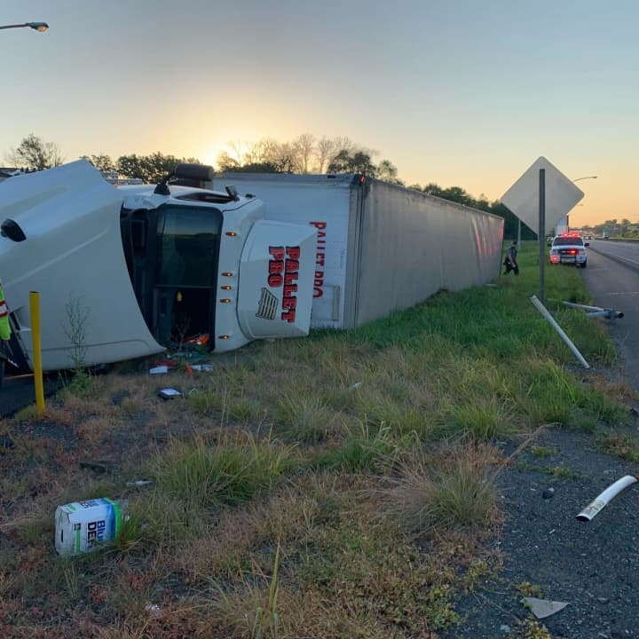 The driver of a tractor-trailer was injured in a rollover crash that damaged a light pole in Northampton County early Wednesday morning, authorities said.