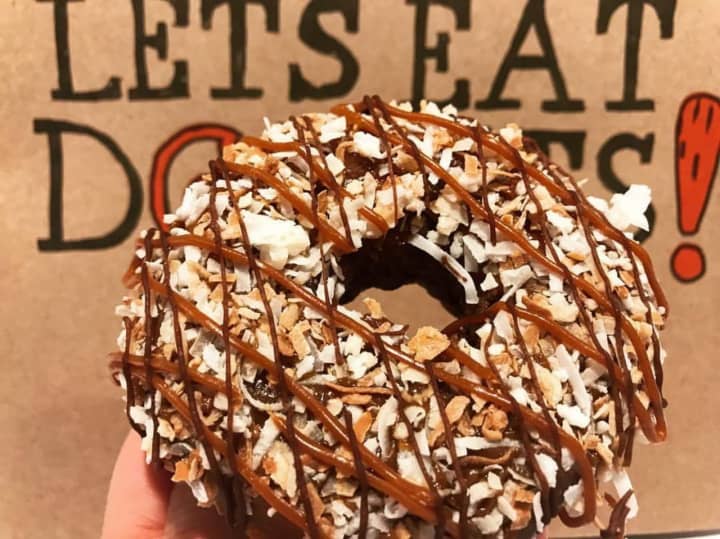 The &quot;Samora&quot; is a cake doughnut half-dipped in milk chocolate, topped with dulce de leche and toasted coconut, and drizzled with more dulce de leche and chocolate.