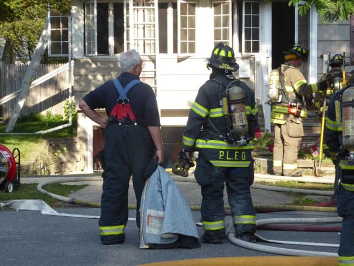 Two Pompton Lakes families were displaced following a structure fire that spread from one house to another.