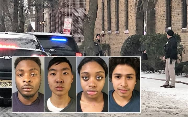 Park (second from left) was captured after he broke a basement window and ran to the roof of a five-story building at Mount Vernon Street and Bergen Avenue, police said.