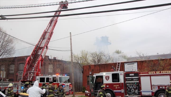 Firefighters kept the Paterson blaze from spreading to nearby buildings.