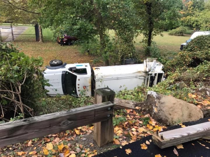 A garbage truck flipped and landed on its side in Croton Point Park.