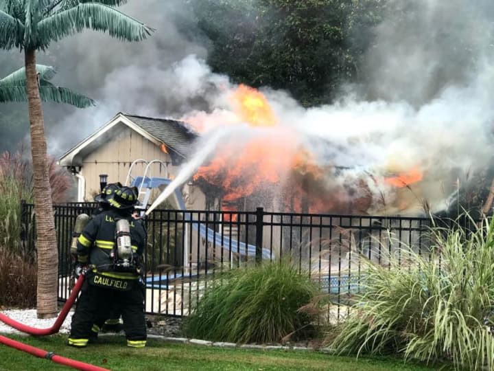 No injuries were reported in a large fire Sunday in a pool house in Trumbull.