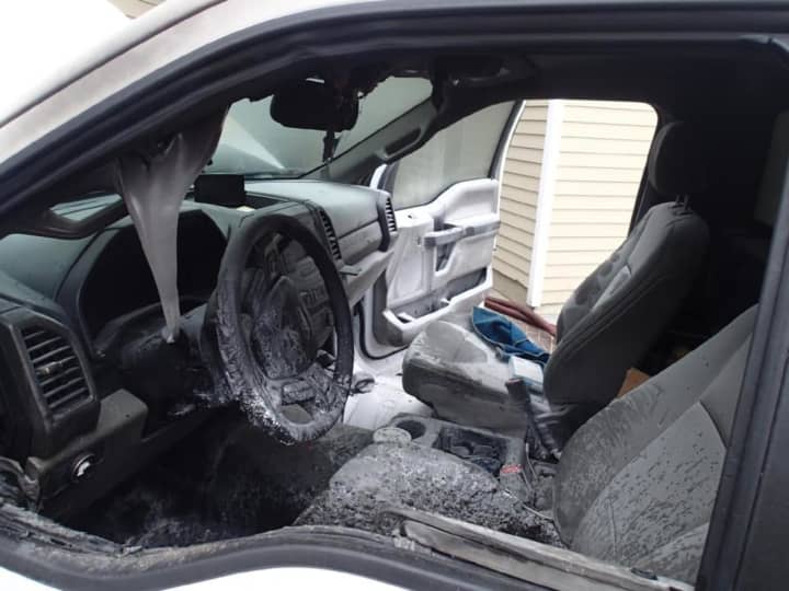 The interior of a car was damaged in a fire in a parking lot on Main Street in Westport on Saturday.