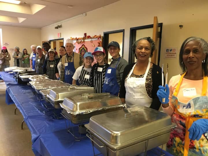 Dozens of volunteers stood at the ready before the start of the Cornerstone Community Church&#x27;s annual Thanksgiving luncheon.