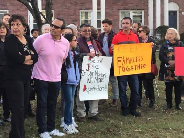 Raphael Benavides joins a rally outside his Stamford home in support of his wife, Miriam Martinez Lemus, who is facing deportation to Guatemala.