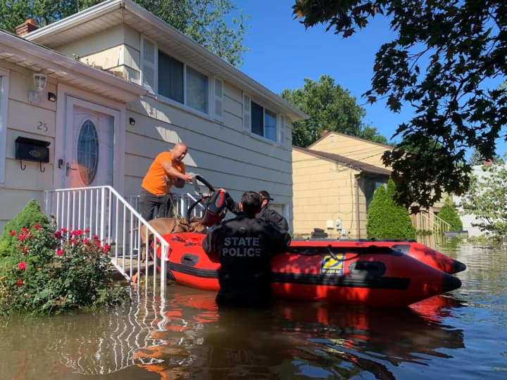 New Jersey State Police rescue residents trapped in houses.