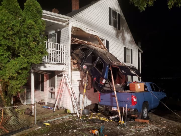 An SUV crash into the second floor of a home.