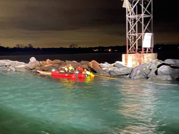 Two kayakers were rescued by firefighters on Long Island Sound after being spotted in distress by an area ferry.