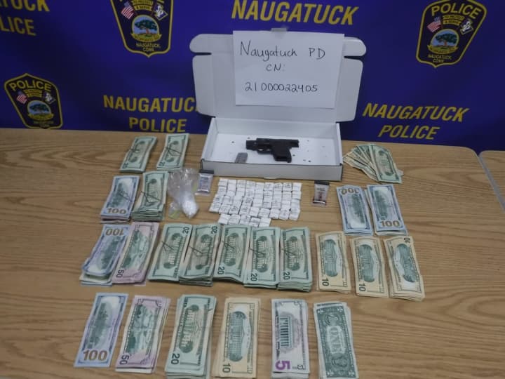 The cash and gun recovered during the incident.