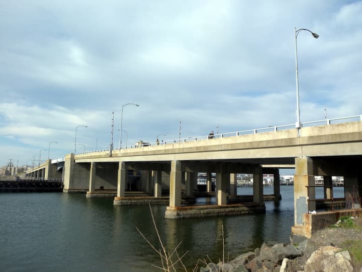 A bridge operator had to be rescued after going through a hole in the deck of the Long Beach Bridge.