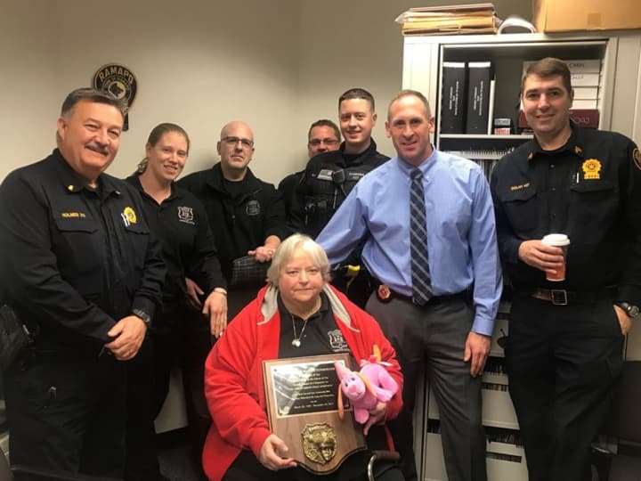 Fellow members of the Ramapo Police Department help celebrate Mary Steinberger&#x27;s retirement.