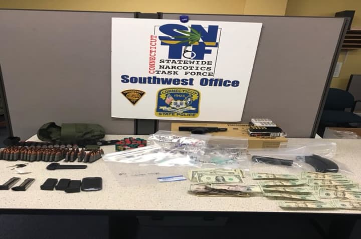 A Bridgeport man pulled over on a windshield violation was found with a loaded gun, drugs and a backpack full of ammunition