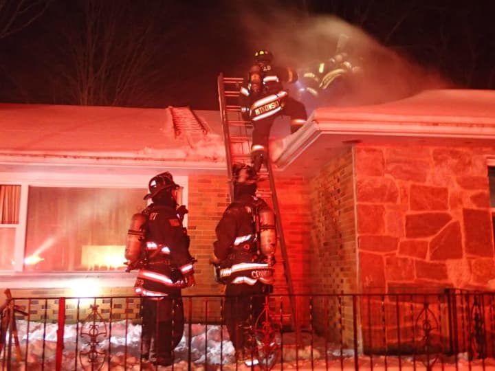 A home in Easton is heavily damaged by fire on Friday evening.