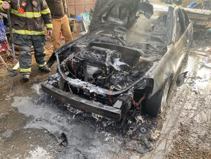 A car that went up in flames just a few feet away from a Sussex County home Wednesday afternoon is under investigation, authorities said.