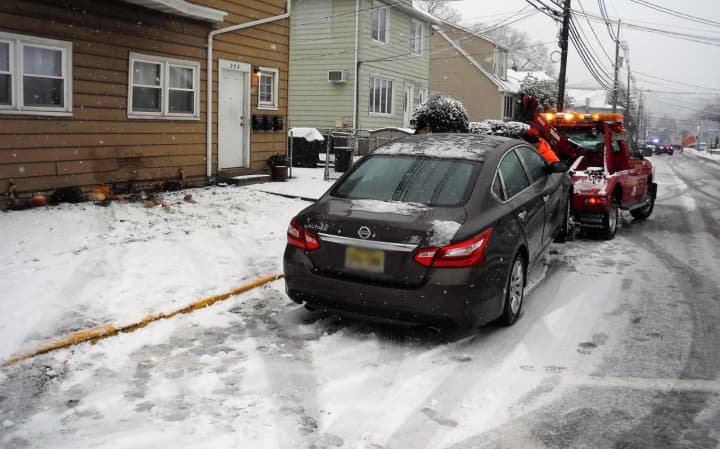 The four-door Nissan sedan was towed after crashing into the Central Avenue multi-family home.