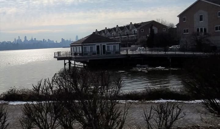 The distraught man was up to his waist in the Hudson, Edgewater police said.