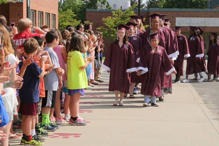 Bethel High School seniors march past younger students during a recent event at Frank A. Berry Elementary School. The Class of 2016 will graduate in a commencement ceremony on Friday.