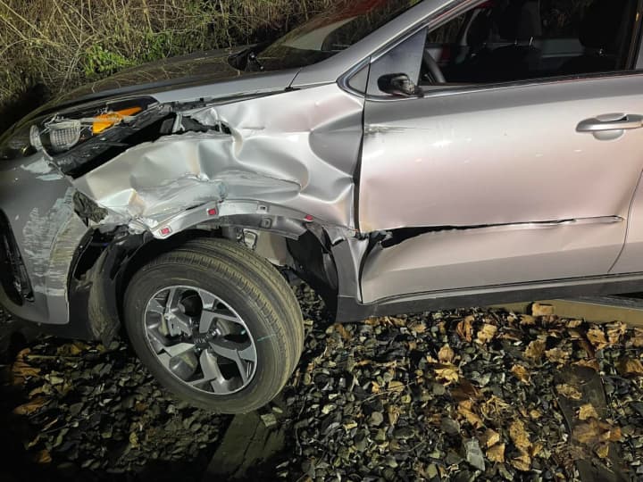 A driver was hurt after crashing into a train car in the Lehigh Valley area early Friday, authorities said.
