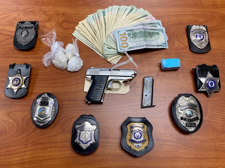 Guns and drugs were seized from a Greenfield apartment during a bust.