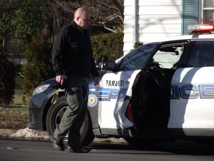 Authorities collect evidence at the scene on Oradell Avenue in Paramus.